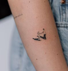 a person with a small tattoo on their arm