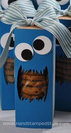 a blue box with some cookies in it and a monster face on the top of it