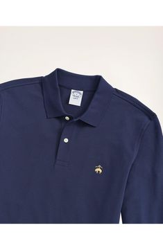 A classic in every way, you just can't go wrong spending your leisure hours in this long-sleeve polo made from a stretch piqué. Spread collar Long sleeves 98% cotton, 2% spandex Machine wash, tumble dry Imported Classic Long Sleeve Polo Shirt For Work, Classic Long Sleeve Polo Shirt With Ribbed Collar, Classic Fitted Long Sleeve Polo Shirt, Fitted Long Sleeve Polo Shirt For Golf, Classic Navy Fitted Polo Sweater, Long Sleeve Cotton Polo Shirt For Golf, Classic Long Sleeve Golf Top, Classic Long Sleeve Cotton Polo Shirt, Cotton Long Sleeve Polo Shirt For Golf