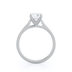 a white gold engagement ring with a single diamond in the center, on a white background