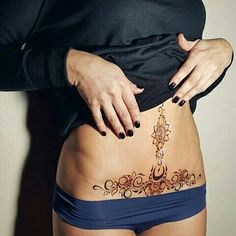 a woman with a tattoo on her stomach