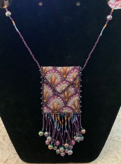 Amulet Bag made of beads and fabric Purple Beaded Bag As Gift, Purple Beaded Bag For Gift, Purple Beaded Bags For Gifts, Beaded Purple Bag For Everyday Use, Purple Beaded Bags For Everyday Use, Purple Beaded Bag For Everyday Use, Purple Beaded Shoulder Bag For Everyday Use, Beaded Brown Shoulder Bag Gift, Everyday Beaded Necklaces With Round Beads