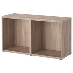 a wooden shelf with two open compartments