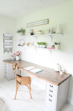 a white room with a desk and chair