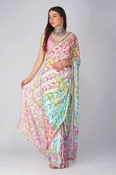 Pink and multi color pre-stitched saree with all over leaf print, attached draped pallu, pleated details, scalloped gota and lace border details. Comes with pink padded blouse with scattered sequin work. - Aza Fashions Saree Blouse Styles, Lehenga Designs Simple, Lehenga Blouse Designs, Fancy Sarees Party Wear, Sari Blouse Designs, Drape Saree, Saree Designs Party Wear, Saree Trends, Latest Sarees