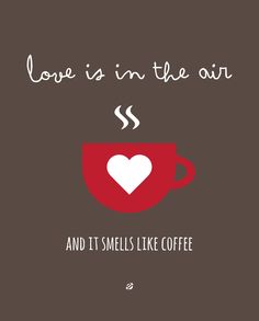 a coffee cup with the words love is in the air and it smells like coffee