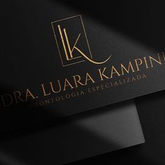 a black and gold business card with the words dra luara kempin on it