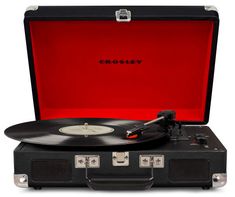 an open suitcase with a record player in it's side pocket and the word crosley printed on the lid