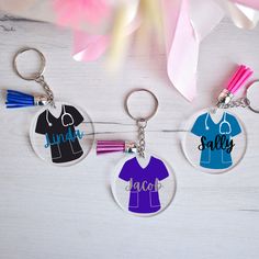 three key chains with personalized items on them