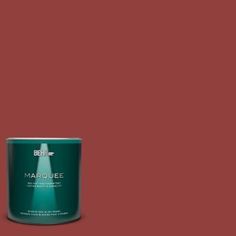 a can of behr marquee paint on a brown background