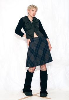 "This plaid blue Y2K vintage skirt is the ultimate rebellious throwback. Feel like a cool 2000s kid, strutting through the halls in your low-rise fit and feeling nostalgia for a time you may or may not have actually experienced. It's a low-rise fit for an EU size 36 and a high-rise fit for a size 38. Features: - zip closure - 48% polyester, 35% wool, 17% cotton - lined Every item we manage is cleaned and, when necessary, repaired, ensuring it arrives to you in top condition. Our model, Panna is 171 cm / 66.7\" tall and she's a size S. Size: S / US 4 / UK 8 / IT 40 Other size info: Labelled size: EU 36 Measurements:  waist: 77 cm / 30.0\" length: 61 cm / 23.8\" Fabric: polyester 48%, wool 35%, cotton 17% Care: Machine wash separately" Dark Academia Goth, Low Rise Skirt, Grunge Skirt, Blue Y2k, Vintage Rock, Cotton Gifts, Black Plaid, Style Expert, Vintage Skirt