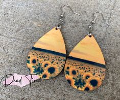 Wooden sunflower earrings. These are double sided! Beautiful and lightweight. Bohemian Yellow Sunflower Earrings, Yellow Sunflower Design Earrings For Summer, Summer Sunflower Dangle Earrings, Sunflower Dangle Earrings For Summer, Adjustable Teardrop Earrings For Summer, Adjustable Teardrop Earrings For Summer Gifts, Summer Sunflower Design Earrings, Sunflower Design Drop Earrings For Summer, Adjustable Sunflower Design Earrings For Summer