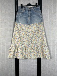 a women's skirt hanging on a wall