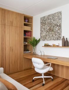 a wooden desk and chair in a room