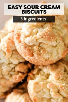 some biscuits are stacked on top of each other with the words, easy sour cream biscuits 3 ingredients