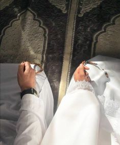 the feet of a person dressed in white