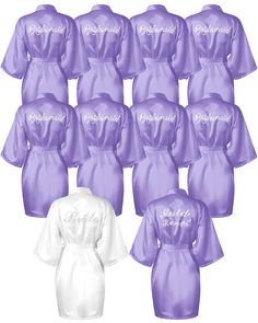 twelve purple and white robes with the word bride written on them