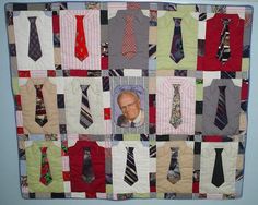 a quilted wall hanging with many ties on it and a man's face