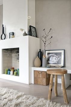 a living room filled with furniture and a fire place