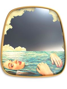 a woman floating in the ocean with her hands on her face and clouds above her head