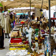 an outdoor flea market with lots of items for sale