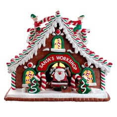 a gingerbread house with santa's workshop on it