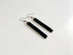 These elegant minimalist drop earrings are great for special occasions or everyday wear. Match these long black earrings with an elegant or casual outfit. Minimalist and sophisticated. These modern black bar earrings are handmade of polymer clay and mounted on stainless steel posts. Suitable for those with sensitive ears. YOU WILL GET → one pair of black long bar earrings → measurements: length - 5 cm (1.96 inches); width - 0,7 cm (0.23 inch); drop length - 7 cm (2.75 inch) → MATERIALS: Polymer Trendy Black Everyday Earrings, Black Dangle Earrings For Everyday, Minimalist Black Linear Earrings For Gifts, Minimalist Black Drop Earrings, Minimalist Black Linear Earrings As Gift, Minimalist Black Linear Drop Earrings, Minimalist Black Single Earring, Sleek Black Everyday Jewelry, Black Dangle Linear Earrings For Pierced Ears