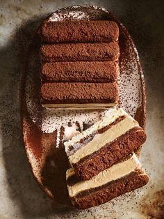 a plate with some cake on it and one slice cut in half next to the rest