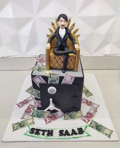 a cake made to look like a game of throne with money coming out of it