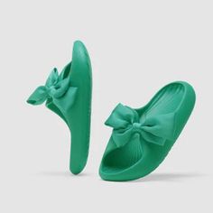 Our new Venita Pretty Bow Sliders are a fun and versatile addition to any outfit. Made of a high-quality material, these sliders are perfect for slipping on before heading out the door. They come in a variety of colors and size and will look great with your favorite pair of jeans or a skirt. Non-slip Slide Slippers For Spring, Green Non-slip Synthetic Slides, Green Eva Flip Flops For Spring, Green Synthetic Slides, Green Casual Eva Slippers, Green Non-slip Slippers For Spring, Spring Green Non-slip Slippers, Green Slide Flip Flops For Spring, Non-slip Eva Slides For Spring