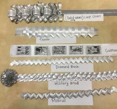 several different types of silver ribbons on display