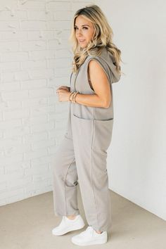 With its oversized hood and doubled front and back pockets, this long jumpsuit not only keeps you warm but also stylish. Introducing the ultimate cozy one-piece: the Flynn French Terry Jumpsuit. The button front henley adds a touch of sophistication to this versatile wardrobe must-have. 100% Cotton Deep Side Pockets, front + back Slouch Fit Oversized Hood Button Front Oversized Armhole SIZING: Model is 5'4" wears a size 5 and is modeling the small. Small 2-4 Medium 6-8 Large 10-12 X-Large 14-16 Lounge Wear Sets, Jean Romper, Long Jumpsuit, Hair Socks, Poncho Tops, Versatile Wardrobe, Long Jumpsuits, Jumpsuit Shorts Rompers, Short Jumpsuit