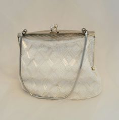 "Here's the brides \"something old\" that still looks brand new!  Its the perfect vintage bridal bag.  Delicate white beading with gold chain and accents and a creamy ivory lining.  5.5\"x4\" bag, base is 6\"x2.5\"" Formal Vintage Evening Bag With Pearl Handle, Vintage White Bags With Pearl Handle, Vintage White Bag With Pearl Handle, Classic White Wedding Bag, Classic White Bridal Accessories For Formal Occasion, Vintage Formal Clutch With Pearl Handle, Classic Clutch Evening Bag For Wedding, Vintage White Party Bags, White Vintage Party Bag