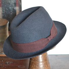 - Brim 1,8 inch. (5cm) . - Crown 4 inch (10 cm).  - Matched with burgundy grosgrain ribbon on the outside of the hat, finished with a square loop bow on the        side.  - Interior unlined, with grosgrain sweatband. A fedora mens hat is a unique and iconical  fashion hat: classic style for  this dark gray fur felt hat with short brim. The velour felt for this fedora is extremely soft to the touch and catches the light producing quite a remarkable effect in the right conditions. This hat is hand - sewn for a professional and precious finish. My hats are made in my Atelier in Turin, Italy, with a traditional millinery techniques: it takes me 4/10 days to steam, block, dry, shape, size and trim a hat Fitted Six-panel Winter Hat, Classic Gray Hat With Short Brim, Classic Burgundy Hats For Fall, Classic Formal Six-panel Hat, Fitted Winter Six-panel Hats, Classic Gray Fedora For Fall, Classic Six-panel Formal Hat, Formal Fitted Six-panel Hat, Classic Six-panel Hat For Formal Occasions