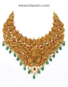 22 Karat Gold "Lakshmi - Peacock" Necklace with Cz, Color Stones, Pearls & Beads (Temple Jewellery)

Enhance Your Beauty with Exquisite 22 Karat Gold "Lakshmi - Peacock" Necklace  Indulge in the timeless elegance of Indian craftsmanship with this stunning 22 Karat Gold "Lakshmi - Peacock" Necklace from Totaram Jewelers. Adorned with shimmering CZ, vibrant Color Stones, lustrous Pearls, and intricate Beads, this piece of Temple Jewellery is a true masterpiece that will make you stand out from the Luxury Multicolor Temple Necklace With Cutdana, Luxury Multicolor Tilla Temple Necklace, Luxury Green Temple Necklace For Celebrations, Luxury Temple Necklace For Puja, Luxury Multicolor Temple Necklace For Women, Luxury Gold Temple Necklace With Peacock Design, Luxury Green Temple Jewelry Chandbalis, 22 Carat Gold Jewellery, Indian Choker