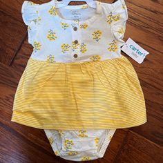 Carters Floral Skirted Romper 12 Months Brand New With Tags Cute Yellow Bottoms For Playwear, Yellow Cotton Playtime Bottoms, Cute Fitted Yellow Bottoms, Yellow Bottoms For Playtime In Spring, Yellow Bottoms For Spring Playtime, Yellow Summer Playwear Bottoms, Playful Yellow Cotton Bottoms, Cute Yellow Bottoms For Playtime, Yellow Cotton Playwear Bottoms