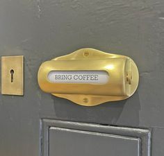 a door handle with a sign that says bring coffee