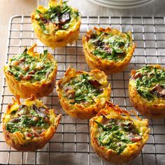 small quiches with spinach and cheese on a cooling rack