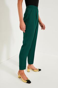 The ultimate closet staple in a fresh colorway, the Dark Green Duncan Pleated Trouser is the pair of pants that will complete your wardrobe and having you reaching for them on repeat. With a flattering high rise, elongating front pleats, and a chic straight leg silhouette, these are perfect from desk to drinks and everywhere in between. Pair them with a tailored blazer, a slouchy tee, or a cardigan — trust us, these can do it all! High rise Zip fly with hidden hook and eye closure Angled hip poc Spring Tapered Workwear Pants, Spring Tapered Pants For Workwear, Tapered Pants For Spring Workwear, Solid Spring Dress Pants With Tapered Leg, Chic Solid Straight Hem Bottoms, Chic Solid Bottoms With Straight Hem, Green Tapered Leg Formal Bottoms, Tailored Pleated Waist Bottoms For Spring, Dark Green Trousers Outfit Women