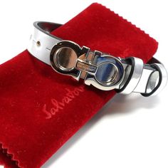 New$460 Salvatore Ferragamo Gancini Metallic Leather Bracelet In Silver Size: 10" Full Length, 4 Holes, 6 3/4" (First Hole) - 7 7/8" (Last Hole); 1/2" Width Made In Italy Brand New W/O Tag! 100% Authentic!!! Logo-Inscribed Gancini Hardware Doubles The Silvery Shine Of This Leather Bracelet With Two Belt-Like Keepers. 100% Calf Leather Silver-Tone Plate Hook And Hole Closure 6 3/4" - 7 7/8" Length; 1/2" Width Brand New W/O Tag With Ferragamo Pouch And Saks Fifth Ave Jewelry Box!! * Ship Fast On S Bracelet In Silver, Mens Accessories Jewelry, Leather Silver, Metallic Leather, Salvatore Ferragamo, Saks Fifth, Calf Leather, Leather Bracelet, Jewelry Box