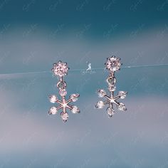 These cute, dainty snow flake stud earrings features snowflake stars shape short drop on stud earrings with cubic zirconia gemstones as decoration, made of solid 925 sterling silver and platinum plating. Add a little spark to your everyday look with these cute dainty snowflake drop earrings or as a gift for your love one. Feel the magic of winter with these elegant snowflake earrings. Made with high-quality materials, these dainty earrings are designed to add a touch of sparkle to your everyday Tiny Snowflake, Stars Shape, Elegant Snowflake, Winter Earrings, Jewelry Making Earrings, Snowflake Earrings, Snow Flake, Making Earrings, Sterling Silver Stud Earrings