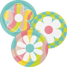 three paper plates with flower designs on them