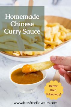 homemade chinese curry sauce in a white bowl with a hand dipping it into a small bowl