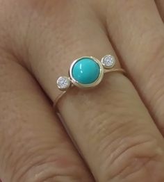 Beautiful Handmade Stackable Turquoise Ring with White Diamond. The Diamonds and Turquoise are carefully set and the Ring is Highly Polished! Nice Gift as A December & April Birthstone Jewelry. Turquoise is One of The Oldest Protection Amulets, and Was Also Known as a Symbol of Wealth in Many Ancient Cultures., Turquoise is Believed to Provide Not Only Protection from Negativity but Also a Clear Connection to the Purity of Natural Elements, Especially the Elements of Water and Air. Metal: Ye Turquoise Gemstone Jewelry For Promise Ring, Turquoise Jewelry With Gemstone Accents For Promise Ring, Turquoise Jewelry With Bezel Setting For Anniversary, Turquoise Bezel Setting Wedding Jewelry, Turquoise Bezel Set Jewelry For Wedding, Turquoise Bezel-set Wedding Jewelry, Turquoise Jewelry With Bezel Setting For Wedding, Turquoise Round Bezel Set Jewelry, Turquoise Ring With Gemstone Accents Fine Jewelry