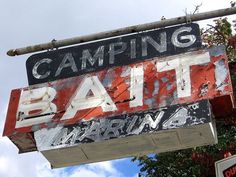 a sign that is hanging from the side of a building advertising a camper's bath