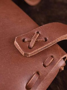 a brown leather case sitting on top of a table