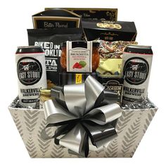 a gift basket filled with assorted snacks and coffees for someone's special occasion