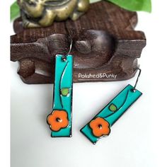 New In Polished And Punky Gift Box Usa Seller Introducing My Stunning Enamel Flower Dangle Earrings, A True Embodiment Of Vibrant Beauty And Graceful Design. These Earrings Feature Delicate Flower Motifs In Bright Shades Of Teal, Orange, And Green, Captivating Attention Wherever You Go. Each Petal Is Beautifully Crafted With Smooth Enamel, Creating A Stunning Glossy Finish That Adds A Touch Of Sophistication. The Lightweight Design Ensures A Comfortable Wear, Allowing You To Enjoy These Earrings Nickel-free Orange Enamel Earrings, Orange Enamel Earrings Nickel Free, Orange Metal Earrings As Gift, Orange Metal Earrings As A Gift, Orange Enamel Dangle Jewelry, Orange Enamel Earrings As A Gift, Orange Enamel Earrings For Gift, Orange Enamel Earrings For Gifts, Vintage Orange Earrings For Gift