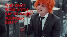 a man with red hair is singing into a microphone and the words, and what would you say to your younger self?