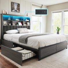 a bed with storage drawers underneath it in a bedroom